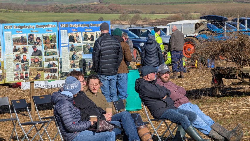 Spectators enjoy the sun